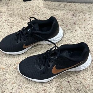 Nike black and gold running shoes